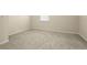 This empty bedroom has neutral colored walls and light colored carpet at 2920 Oriole Dr, Sarasota, FL 34243