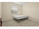 Bedroom featuring a neutral color scheme, a plush carpet, and ample natural light at 2920 Oriole Dr, Sarasota, FL 34243