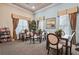 Well-lit reading room in community clubhouse with cozy tables, chairs, and shelving at 2920 Oriole Dr, Sarasota, FL 34243