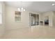 Open dining room featuring tile flooring, an elegant chandelier, and access to an outdoor patio at 2920 Oriole Dr, Sarasota, FL 34243