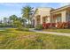 Exterior of building featuring lush landscaping with palm trees and well-maintained green lawn at 2920 Oriole Dr, Sarasota, FL 34243