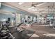 Bright community gym with modern exercise equipment, ceiling fans, and natural light from multiple windows at 2920 Oriole Dr, Sarasota, FL 34243