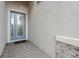 Elegant front door with decorative glass detailing, framed by light brick, and neutral walls at 2920 Oriole Dr, Sarasota, FL 34243