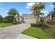 Charming single-story home featuring a tile roof, two car garage, and lush landscaping at 2920 Oriole Dr, Sarasota, FL 34243