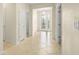 This hallway has tan tile and light colored walls at 2920 Oriole Dr, Sarasota, FL 34243