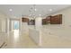 Open-concept kitchen area with pendant lighting and bar seating, perfect for entertaining at 2920 Oriole Dr, Sarasota, FL 34243