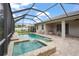The screened-in pool and spa area provide a private retreat with lush greenery and ample sunshine at 2920 Oriole Dr, Sarasota, FL 34243