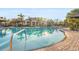 Beautiful community swimming pool surrounded by lush landscaping and lounge chairs at 2920 Oriole Dr, Sarasota, FL 34243