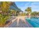 Community pool area featuring a covered lounge area and ample seating for residents at 2920 Oriole Dr, Sarasota, FL 34243