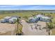 Expansive property featuring a home, detached garage, and a sprawling green landscape at 29527 Leah Rd, Punta Gorda, FL 33982