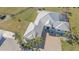 Aerial view of the roof, driveway, and landscaping at 29527 Leah Rd, Punta Gorda, FL 33982