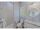 Bright bathroom featuring modern fixtures, tiled shower, and plenty of natural light at 29527 Leah Rd, Punta Gorda, FL 33982
