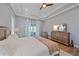 A spacious main bedroom features wood floors, a tray ceiling, and patio access at 29527 Leah Rd, Punta Gorda, FL 33982