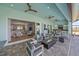 Inviting outdoor living area with fireplace, ample seating and seamless indoor-outdoor flow at 29527 Leah Rd, Punta Gorda, FL 33982