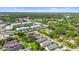 Aerial view of the community showcasing well-maintained homes, landscaping, and a serene lake at 3362 Howell Pl, Sarasota, FL 34232
