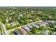 Community aerial shot of homes near a lake with lush greenery and scenic neighborhood views at 3362 Howell Pl, Sarasota, FL 34232