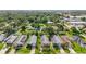 Aerial view of homes with neat landscaping, driveways, and surrounding trees for privacy at 3362 Howell Pl, Sarasota, FL 34232