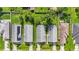 Aerial top-down of neighborhood homes with green lawns, driveways, and one with solar panels at 3362 Howell Pl, Sarasota, FL 34232