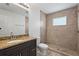Bathroom with granite countertop, step-in shower with glass window at 3362 Howell Pl, Sarasota, FL 34232