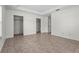 A bright bedroom with tile flooring, two closets, and a tray ceiling at 3362 Howell Pl, Sarasota, FL 34232