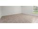 Neutral bedroom with tile floors and bright natural light at 3362 Howell Pl, Sarasota, FL 34232