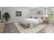A bright bedroom with neutral decor and diamond patterned rug at 3362 Howell Pl, Sarasota, FL 34232