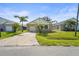 Charming single-story home with a brick paver driveway and well-maintained lawn and landscaping at 3362 Howell Pl, Sarasota, FL 34232