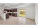 Well-lit kitchen with breakfast bar that opens to the backyard at 3362 Howell Pl, Sarasota, FL 34232
