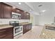 Modern kitchen features stainless steel appliances, granite countertops, and ample cabinet space at 3362 Howell Pl, Sarasota, FL 34232