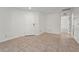 Living room featuring tile flooring, white walls, and ample natural light at 3362 Howell Pl, Sarasota, FL 34232