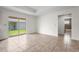 Bright living room with sliding glass doors leading to backyard at 3362 Howell Pl, Sarasota, FL 34232