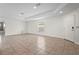 Spacious open-concept living room with tile flooring. and natural light coming from window at 3362 Howell Pl, Sarasota, FL 34232