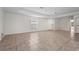 Bright, expansive living room with tile floors and ample natural light. Perfect for entertaining or relaxing at 3362 Howell Pl, Sarasota, FL 34232