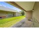 Spacious brick paver patio with covered area and view of lush backyard at 3362 Howell Pl, Sarasota, FL 34232