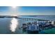 Stunning aerial view of condos on the water, with a bridge visible in the background on a sunny day at 350 Golden Gate Pt # 61, Sarasota, FL 34236