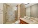 Modern bathroom featuring a glass-enclosed shower and a stylish vanity with a unique sink at 350 Golden Gate Pt # 61, Sarasota, FL 34236