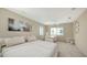 Bright bedroom offers a comfortable bed, a desk, and lots of natural light at 350 Golden Gate Pt # 61, Sarasota, FL 34236