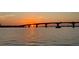 View of the bridge at sunset on the water with dark skies and sunshine reflecting off of the water at 350 Golden Gate Pt # 61, Sarasota, FL 34236