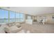 Comfortable condo living and dining room with ample seating and amazing water views at 350 Golden Gate Pt # 61, Sarasota, FL 34236