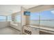 Cozy sitting room with built in shelves and cabinets, a wine rack and panoramic water views at 350 Golden Gate Pt # 61, Sarasota, FL 34236