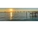 Scenic waterfront view of a beautiful sunset over the bridge and bay at 350 Golden Gate Pt # 61, Sarasota, FL 34236