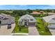 Expansive aerial view of a beautifully landscaped home showcasing its stylish architectural design and curb appeal at 3621 Wild Blossom Pl, Parrish, FL 34219