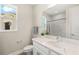 Bathroom with a tub and shower combo with white marble style tile and a vanity with white marble countertop at 3621 Wild Blossom Pl, Parrish, FL 34219