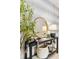 Close-up of a stylish console table in the hallway, featuring decorative items and patterned wallpaper at 3621 Wild Blossom Pl, Parrish, FL 34219