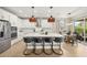 Spacious kitchen featuring a large center island with seating and stainless steel appliances at 3621 Wild Blossom Pl, Parrish, FL 34219