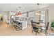 Bright, modern kitchen with stainless steel appliances, a large island, and an adjacent dining area at 3621 Wild Blossom Pl, Parrish, FL 34219