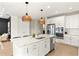 Well-lit kitchen featuring a large island, stainless steel appliances, and a cozy breakfast nook at 3621 Wild Blossom Pl, Parrish, FL 34219