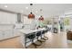 Open kitchen showcasing a large island, stainless steel appliances, and access to the patio at 3621 Wild Blossom Pl, Parrish, FL 34219