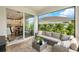 Covered patio looking through a sliding glass door into the kitchen and living area at 3621 Wild Blossom Pl, Parrish, FL 34219