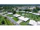 Aerial shot showcases a property with lush greenery, a community pool, and a serene neighborhood ambiance at 3641 Somerville Dr # 1506, Sarasota, FL 34232